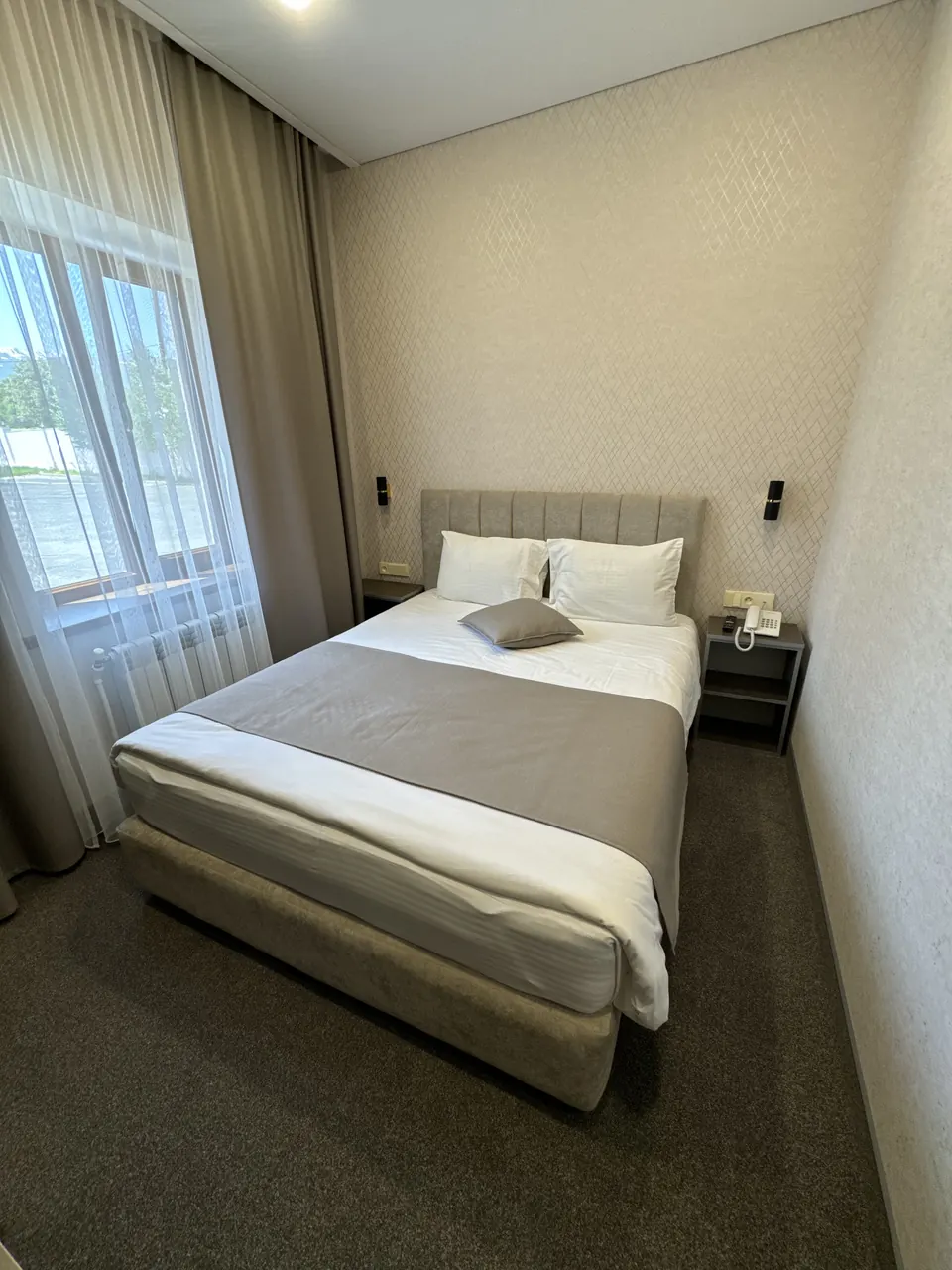 Deluxe Room with a double bed by the window